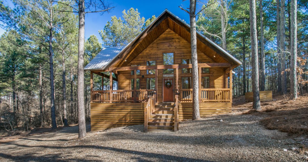 A wooden bench in front of a house