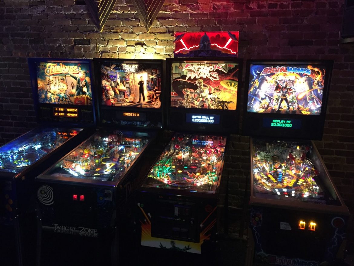 A group of people performing on stage in front of a window